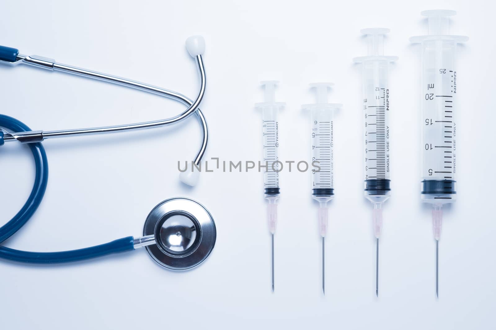 Blue stethoscope and syringe by zneb076