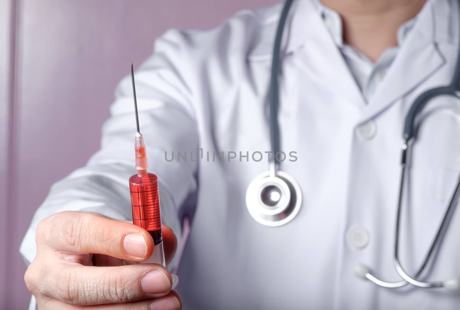 Doctor with syringe, red vaccine syringe, doctor holding syringe  and stretch out.