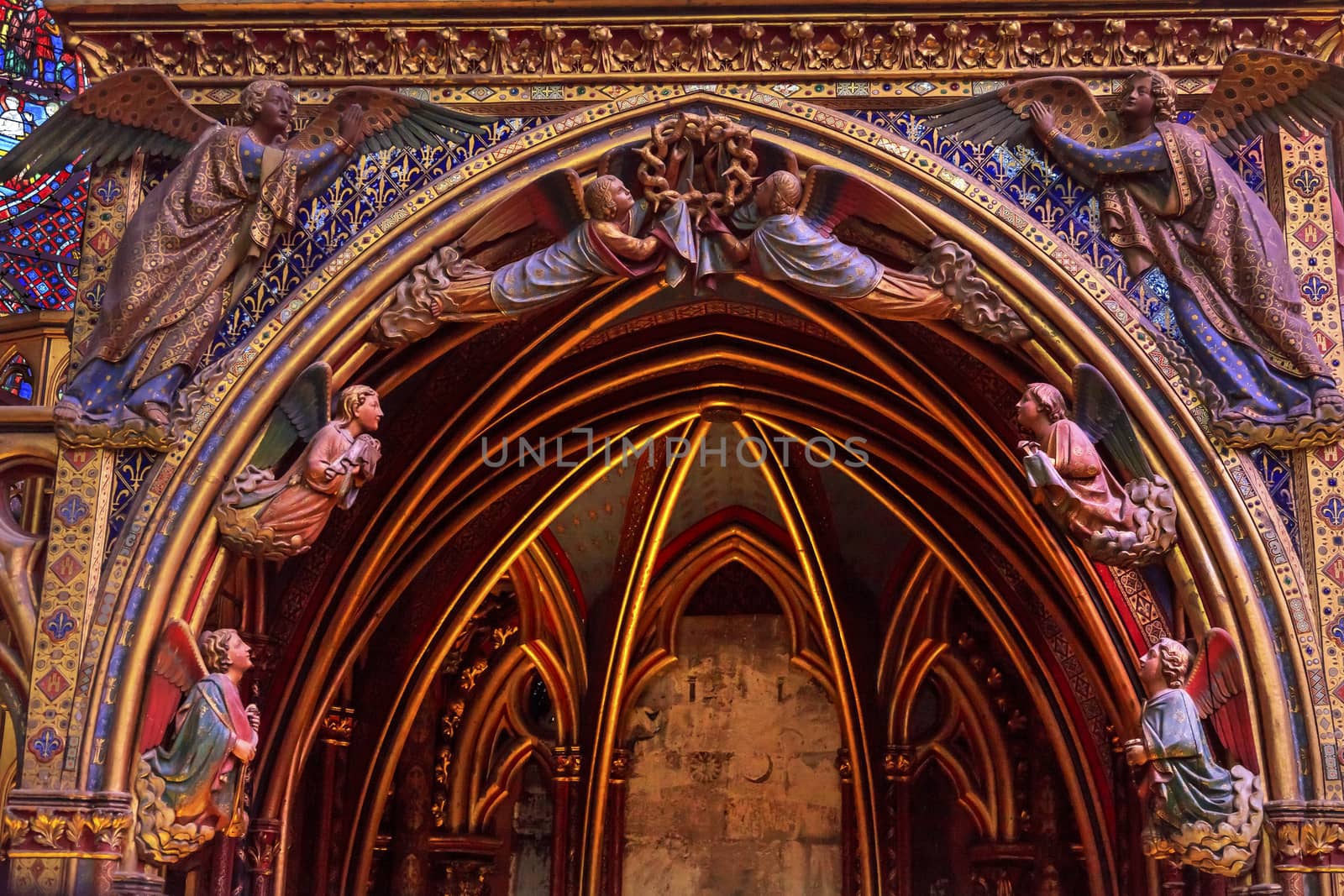 Angels Wood Carvings Arch Cathedral Saint Chapelle Paris France.  Saint King Louis 9th created Sainte Chappel in 1248 to house Christian relics, including Christ's Crown of Thorns.  Stained Glass created in the 13th Century and shows various biblical stories along wtih stories from 1200s.