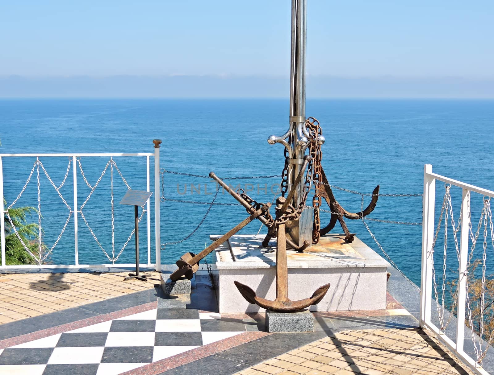 Memorable place to the sunk ships and the lost seamen on the sea.  Crimea, the area in front of the Church-lighthouse on the bank of the Black Sea. Southern coast of Crimea. Memorial place. Old  anchors sunken ships from the bottom of the Black sea.