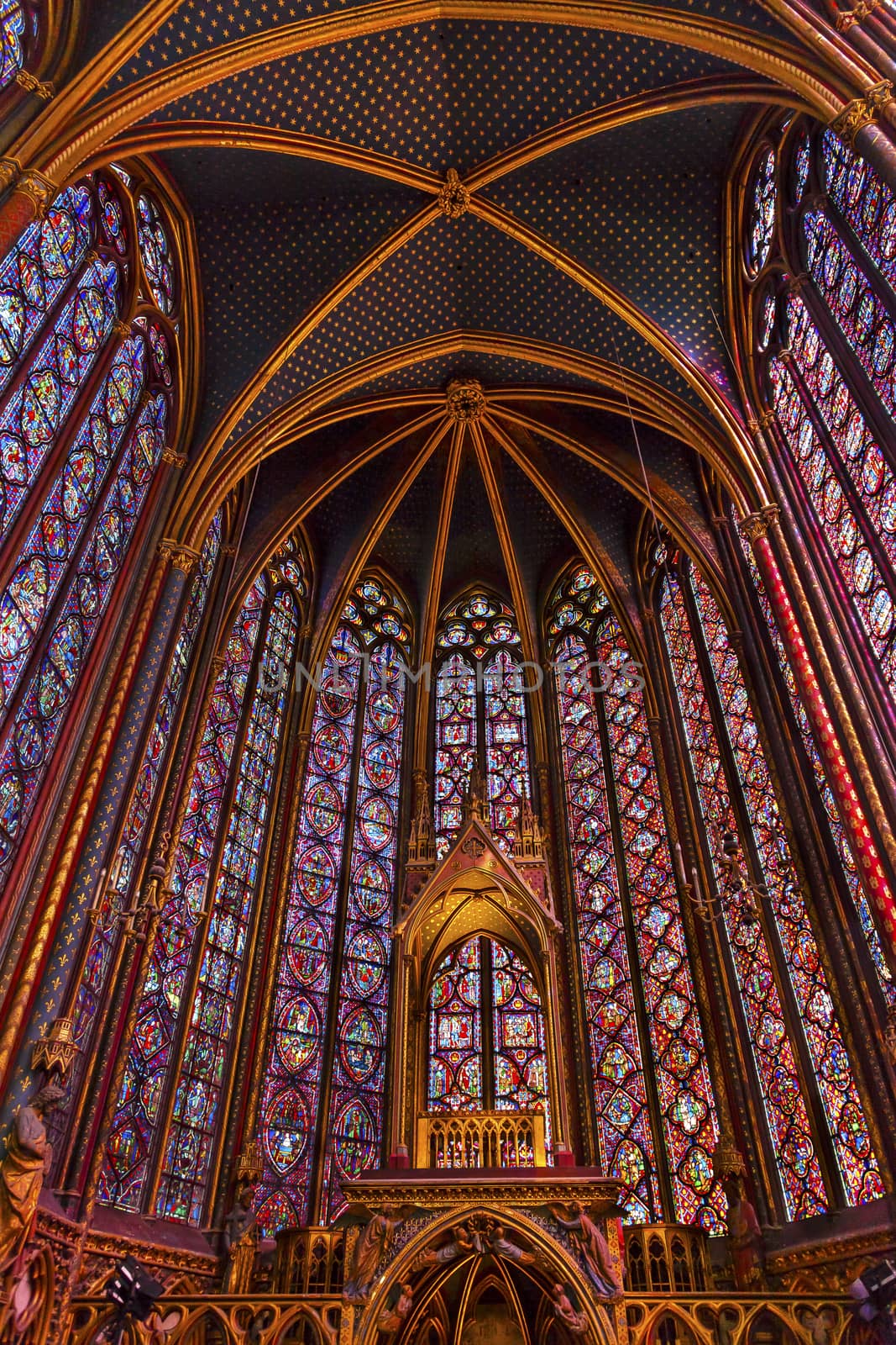 Stained Glass Saint Chapelle Cathedral Paris France.  Saint King Louis 9th created Sainte Chappel in 1248 to house Christian relics, including Christ's Crown of Thorns.  Stained Glass created in the 13th Century and shows various biblical stories along wtih stories from 1200s.