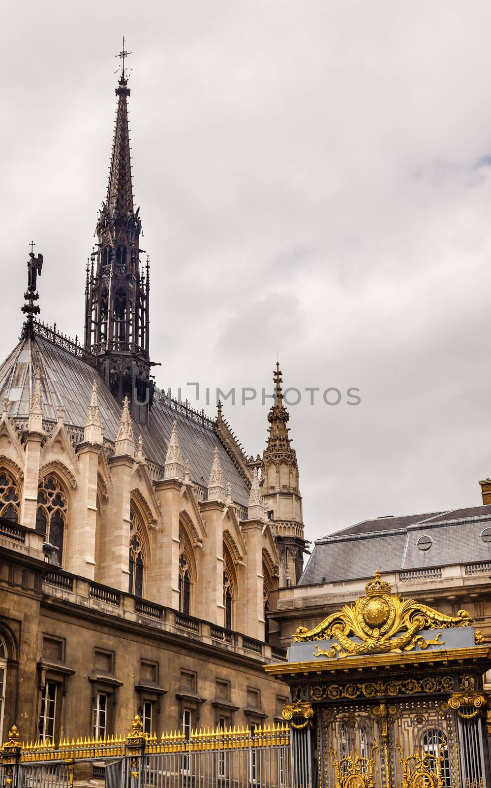 Cathedral Spires Saint Chapelle Golden Gate Palace of Justice Court Paris France.  Saint King Louis 9th created Sainte Chappel in 1248 to house Christian relics, including Christ's Crown of Thorns. 