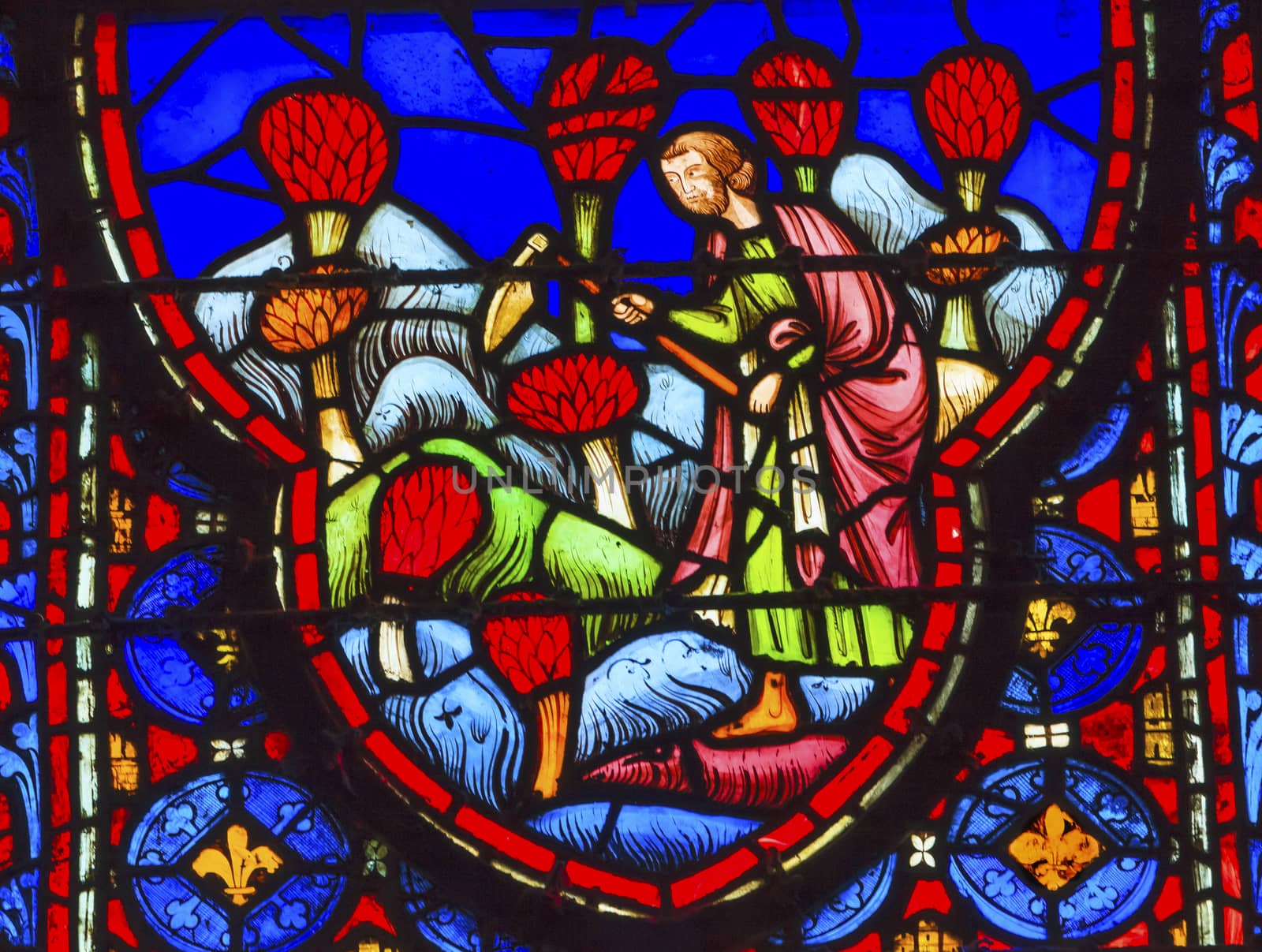 Farmers Flowers Medieval Life Stained Glass Saint Chapelle Paris France.  Saint King Louis 9th created Sainte Chapelle in 1248 to house Christian relics, including Christ's Crown of Thorns.  Stained Glass created in the 13th Century and shows various biblical stories along with stories from 1200s.