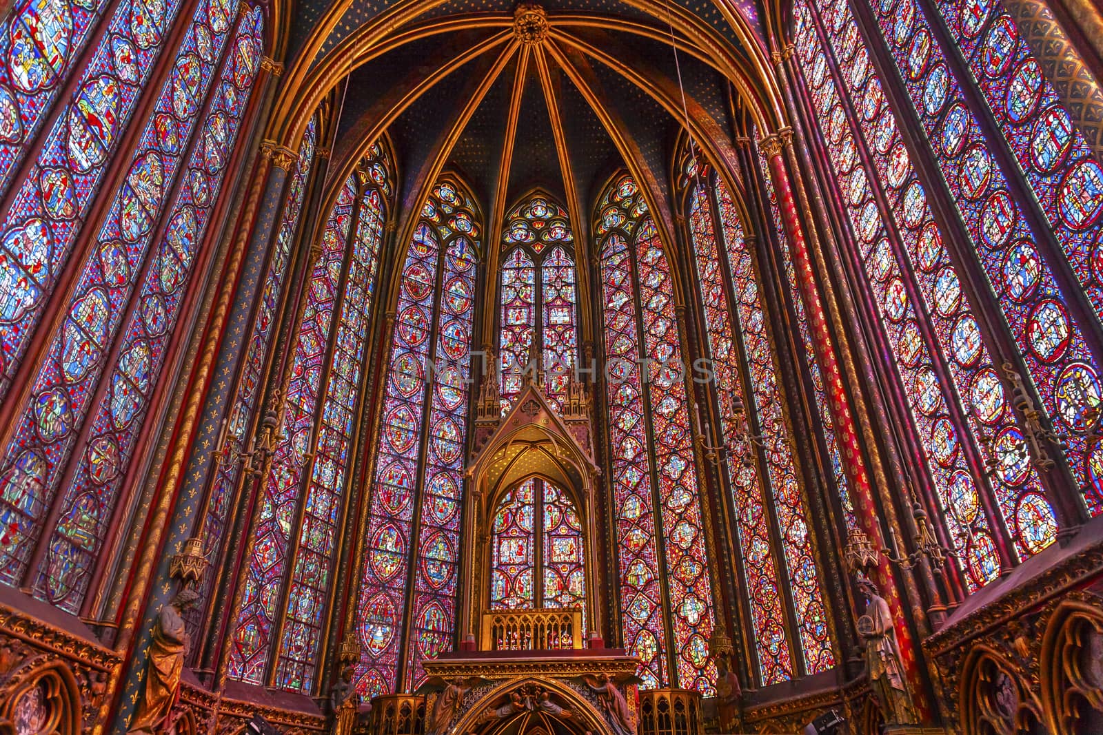 Stained Glass Saint Chapelle Cathedral Paris France.  Saint King Louis 9th created Sainte Chappel in 1248 to house Christian relics, including Christ's Crown of Thorns.  Stained Glass created in the 13th Century and shows various biblical stories along wtih stories from 1200s.