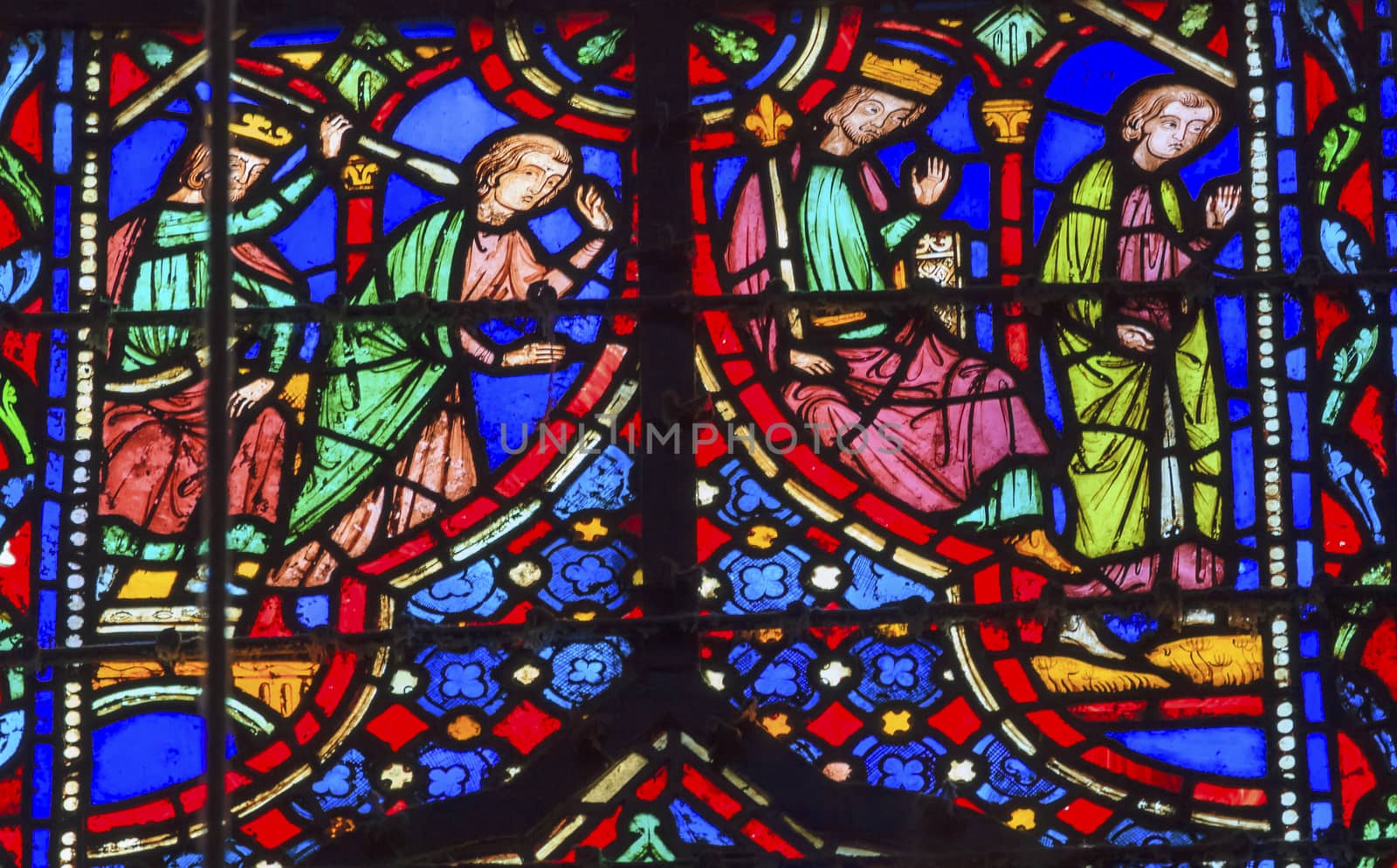 King Killing Medieval Life Stained Glass Saint Chapelle Paris France.  Saint King Louis 9th created Sainte Chapelle in 1248 to house Christian relics, including Christ's Crown of Thorns.  Stained Glass created in the 13th Century and shows various biblical stories along with stories from 1200s.