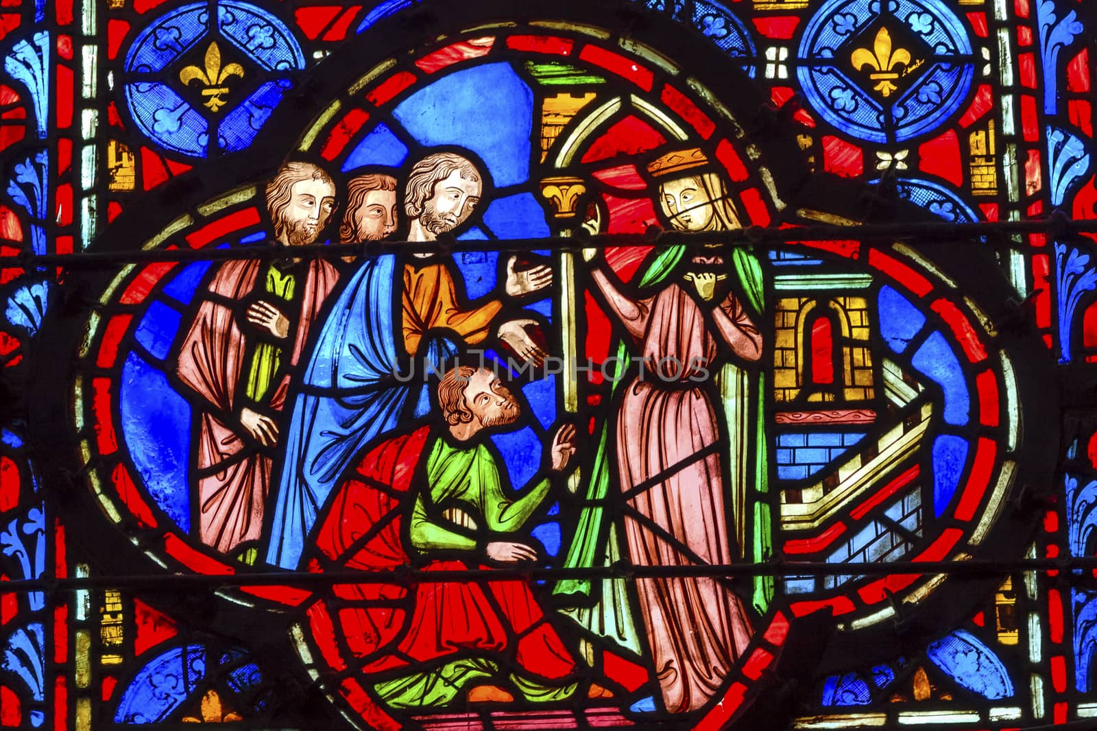 Queen With Followers Medieval Life Stained Glass Saint Chapelle Paris France.  Saint King Louis 9th created Sainte Chapelle in 1248 to house Christian relics, including Christ's Crown of Thorns.  Stained Glass created in the 13th Century and shows various biblical stories along with stories from 1200s.