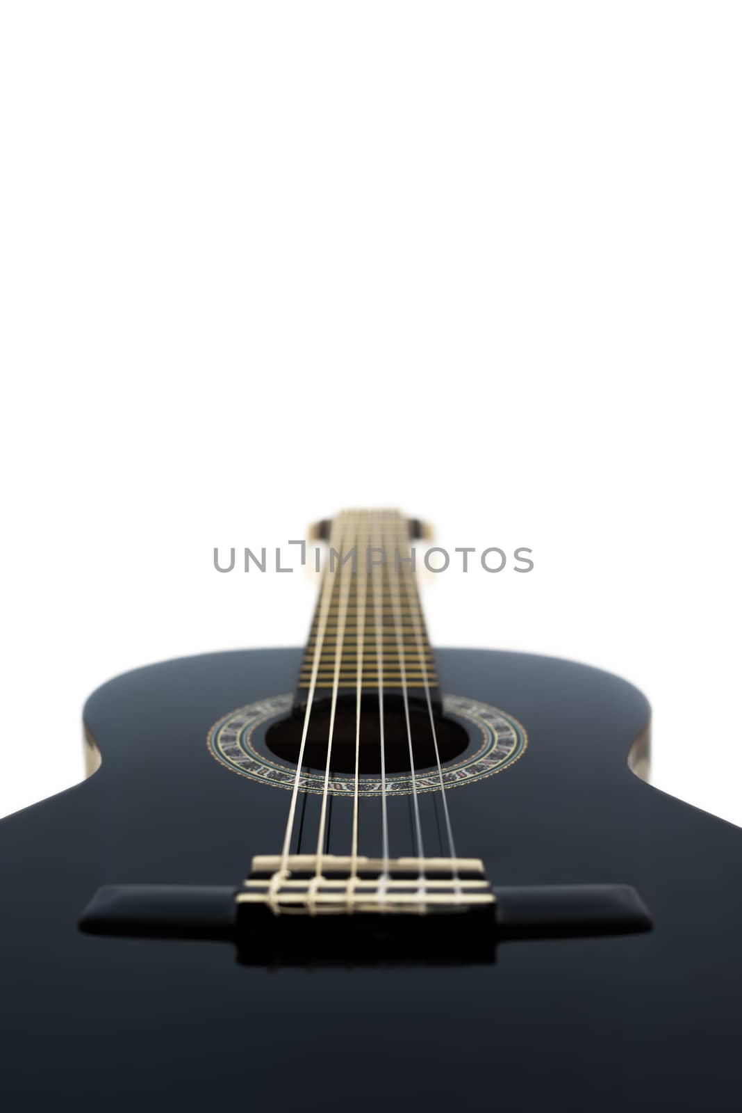Detail of Black Wooden Classical Acoustic Guitar Isolated on a White Background