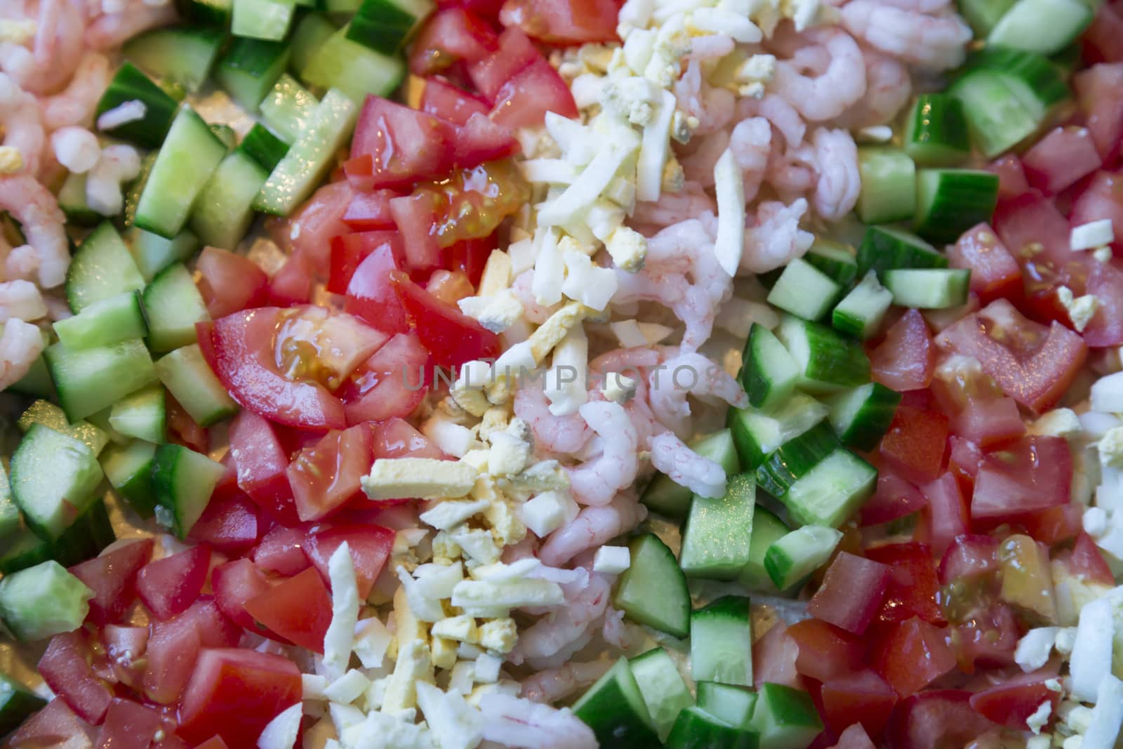 Sandwich layer cake Topping consisting of cucumber, eggs, and tomato.