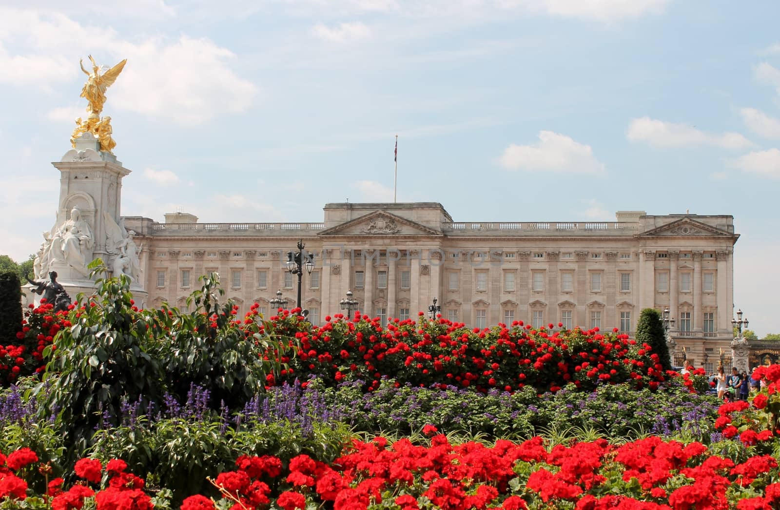 Buckingham Palace With Flowers Blooming In The Queen's Garden, London, England