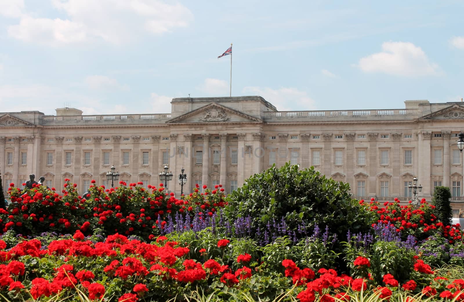 Buckingham Palace With Flowers Blooming In The Queen's Garden, London, England