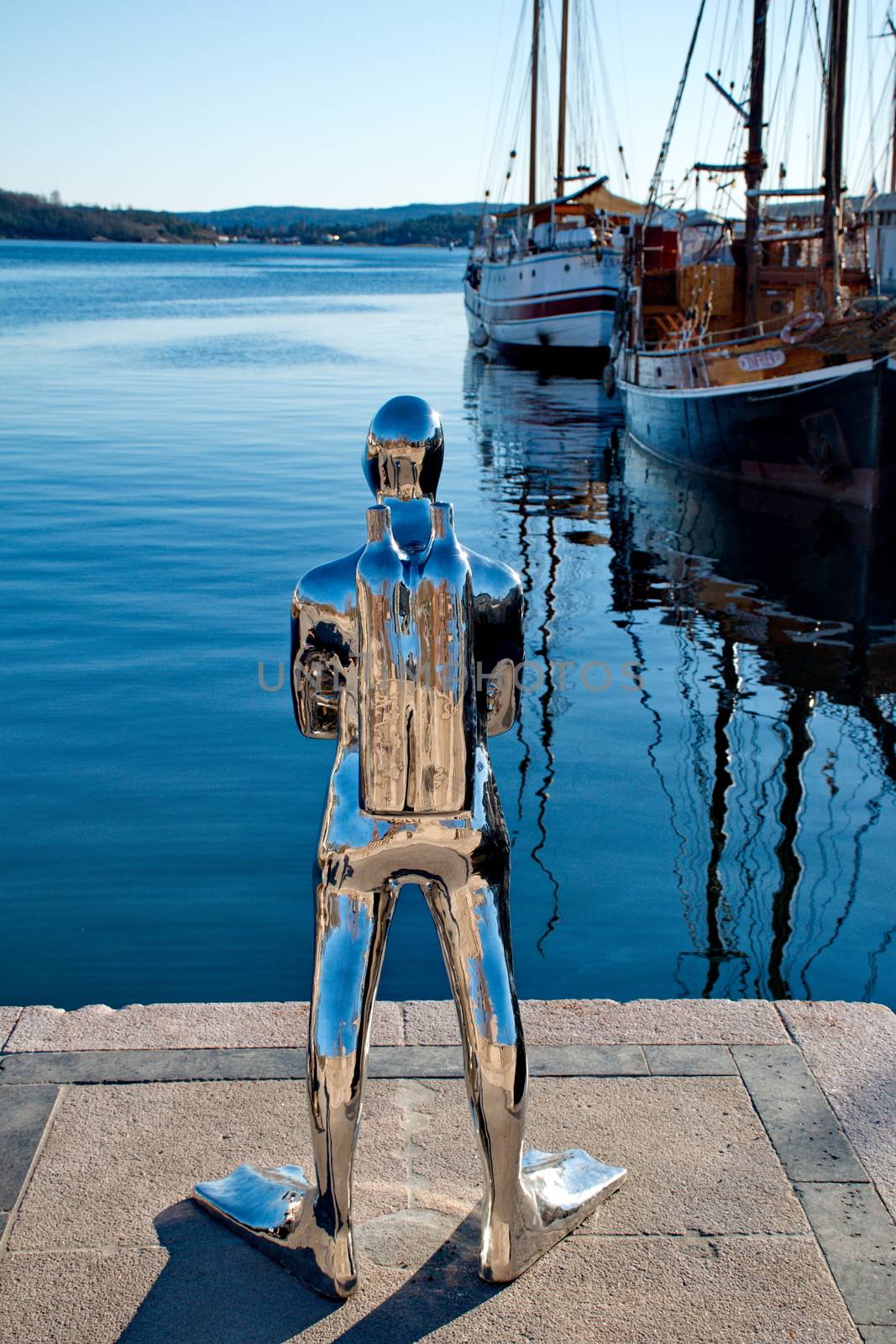 OSLO - MARCH 21: Contemporary scuplture of a diverr in Oslo harb by anderm