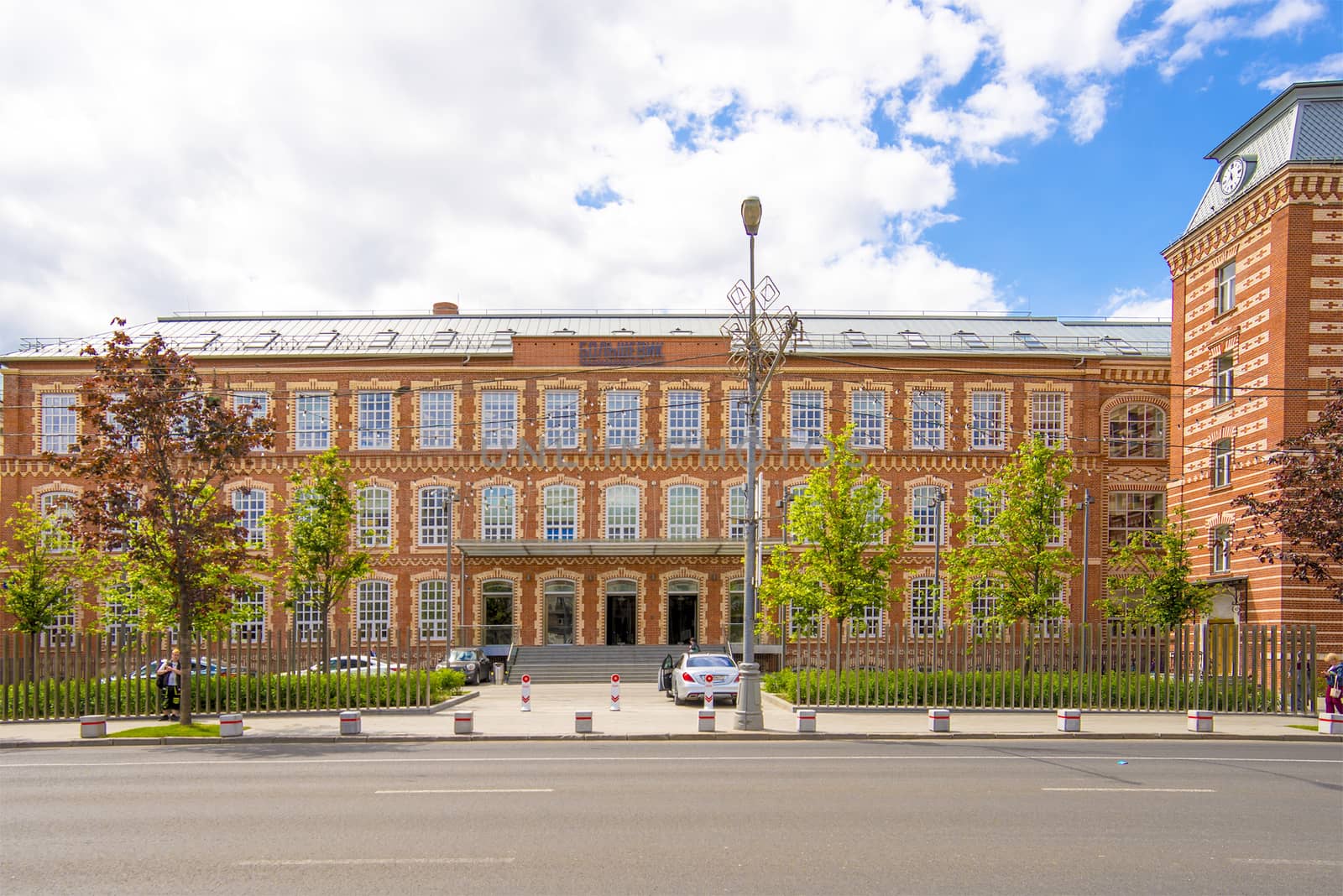 Facade of an old office building of red brick by rogkoff