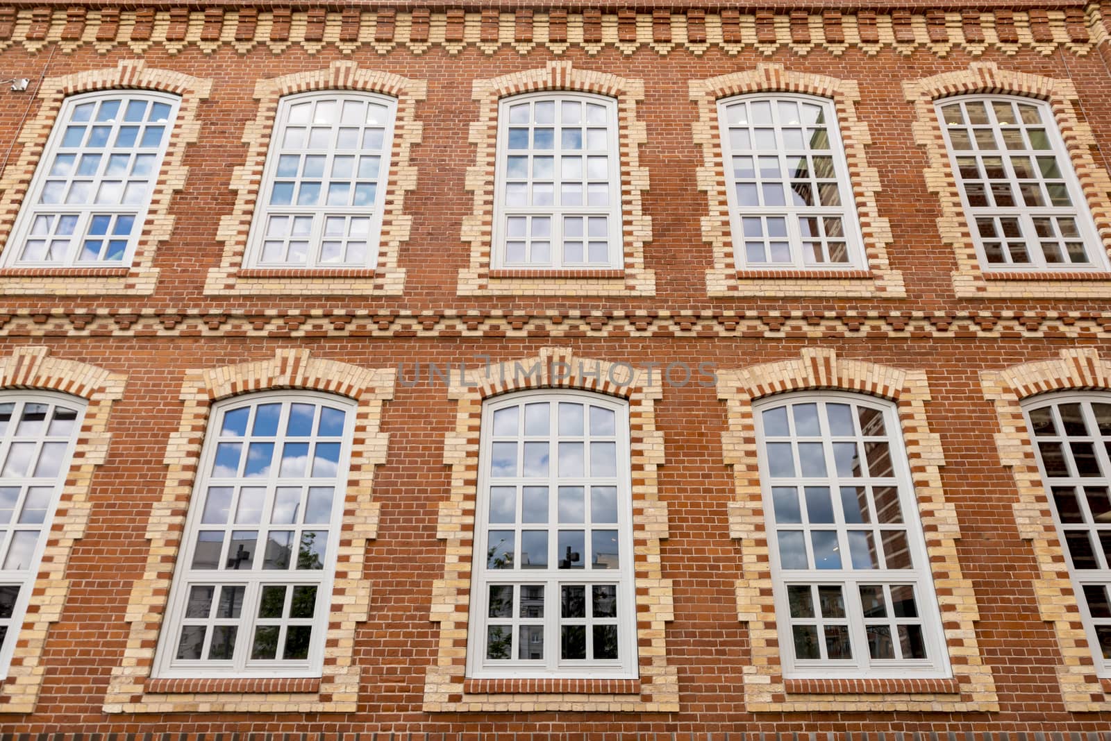 Facade of an old office building of red brick
