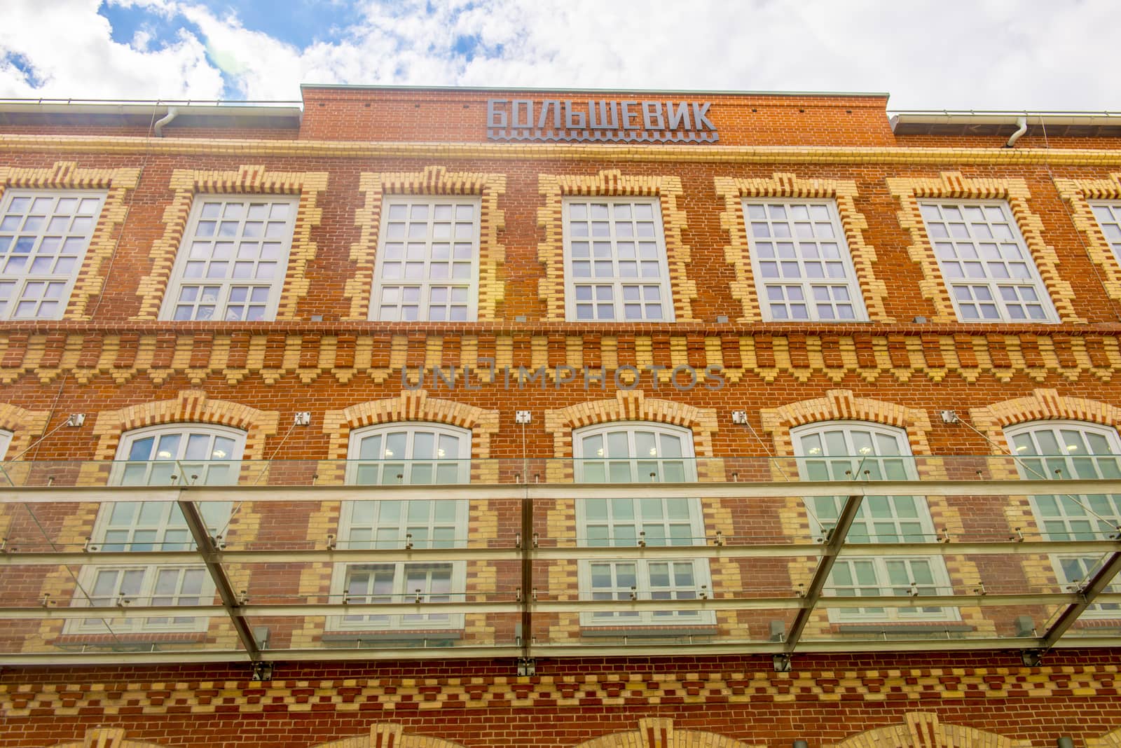 Facade of an old office building of red brick by rogkoff