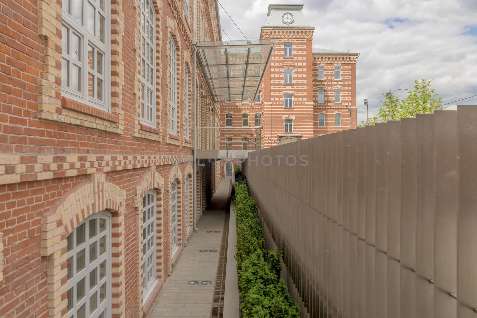 Facade of an old office building of red brick by rogkoff