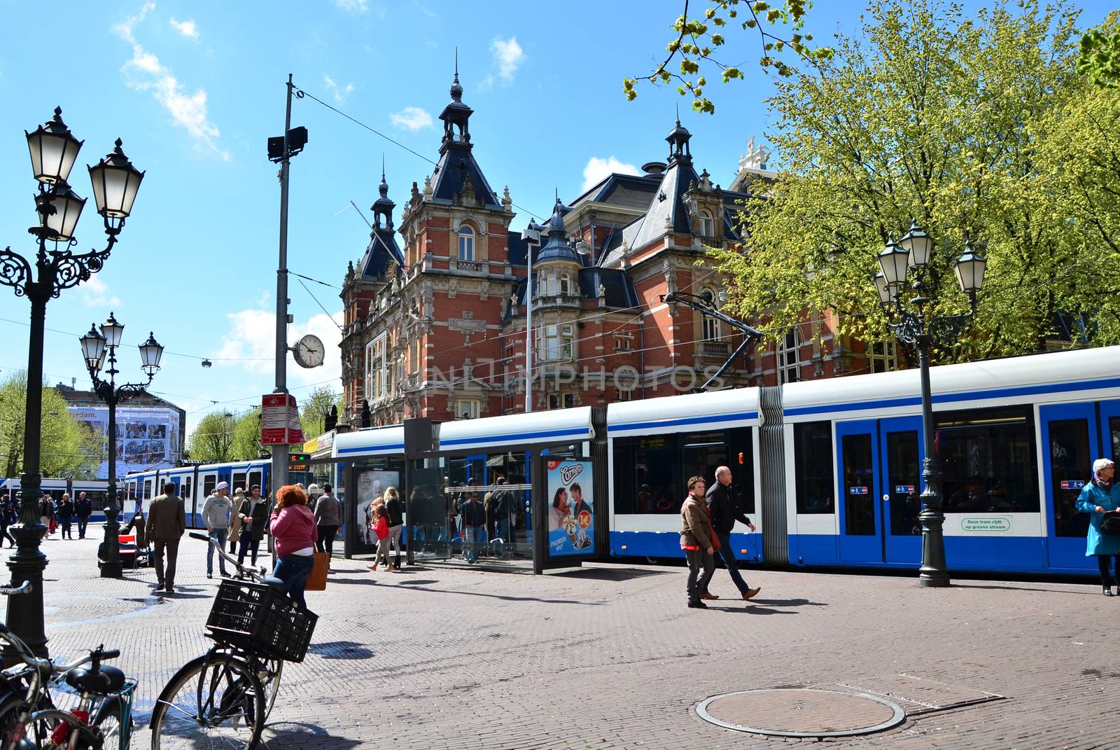 Amsterdam, Netherlands - May 6, 2015: People around Stadsschouwburg building (Municipal theater) at Leidseplein in Amsterdam, Netherlands
