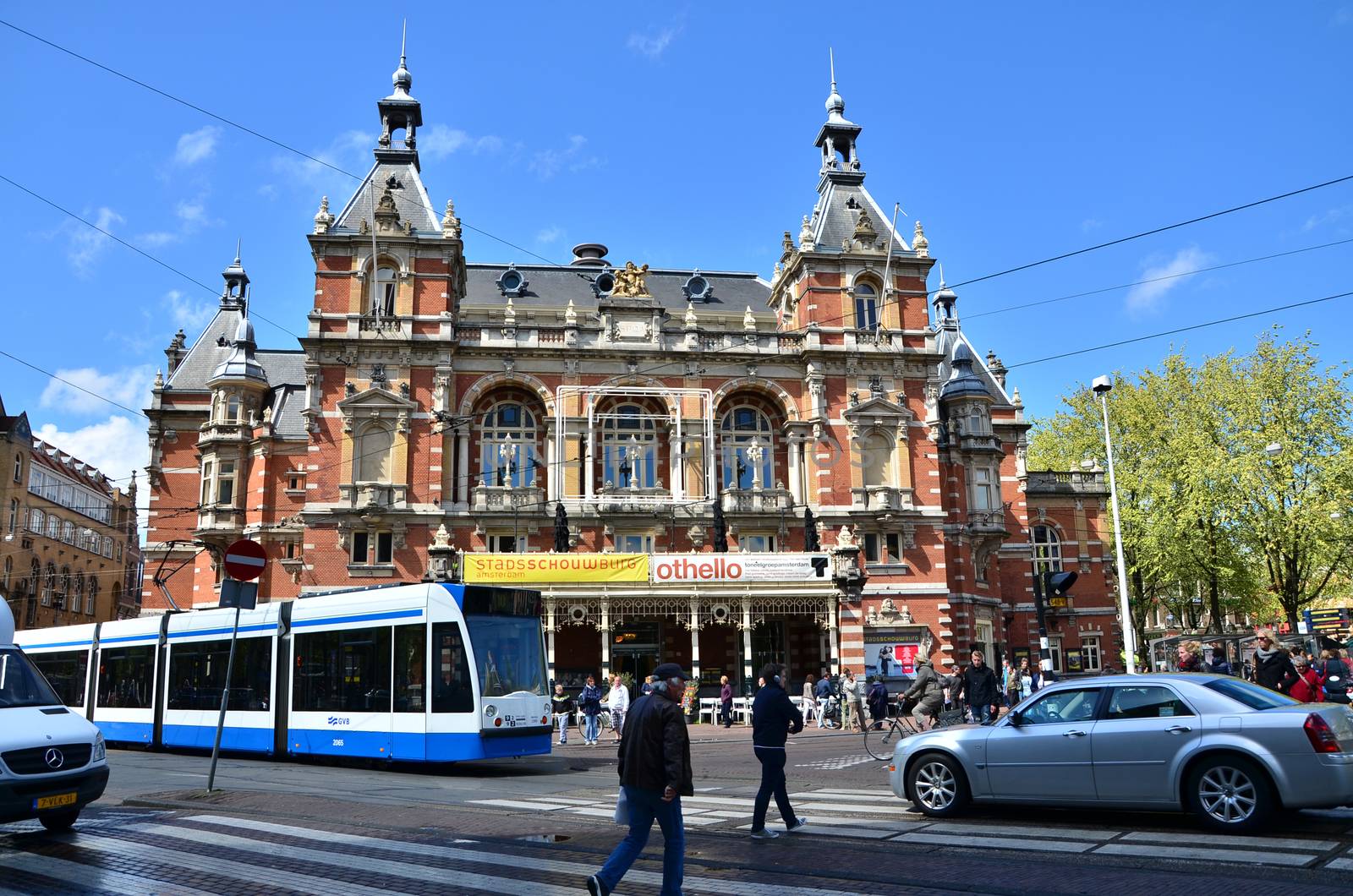 Amsterdam, Netherlands - May 6, 2015: People around Stadsschouwburg building (Municipal theater) at Leidseplein in Amsterdam, Netherlands