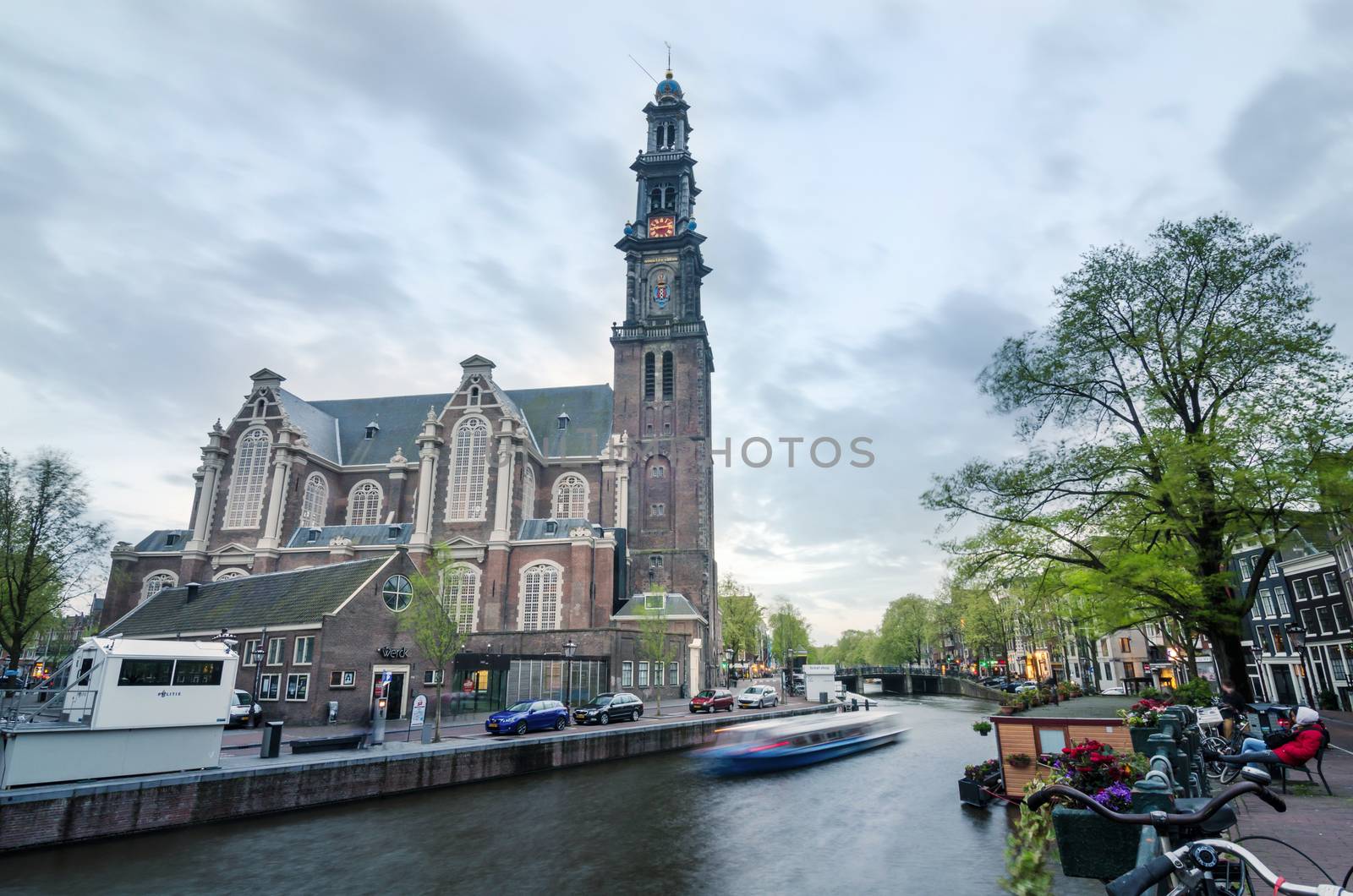 Amsterdam, Netherlands - May 7, 2015: People at Westerkerk in Amsterdam by siraanamwong