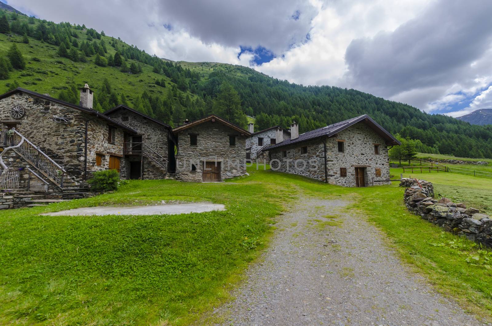 Stone houses. Traditional alpine village in the mountains by rogkoff