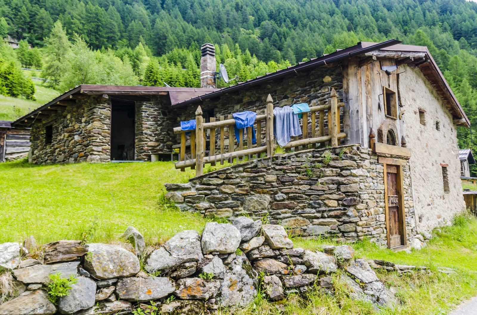Stone houses. Traditional alpine village in the mountains by rogkoff