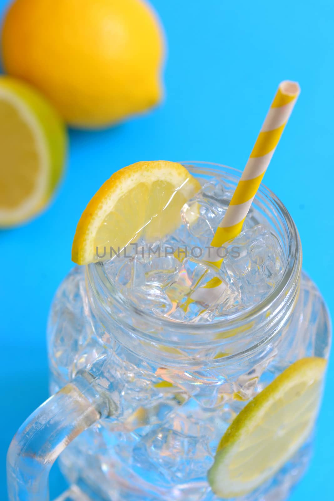 water with lemons and paper straw