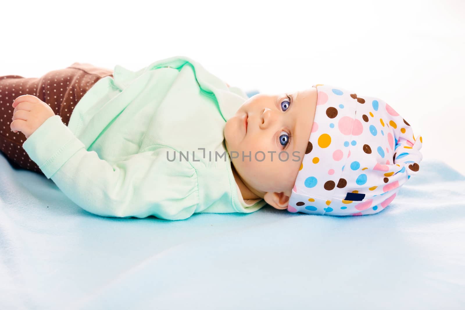 the baby in the hat on a blue blanket