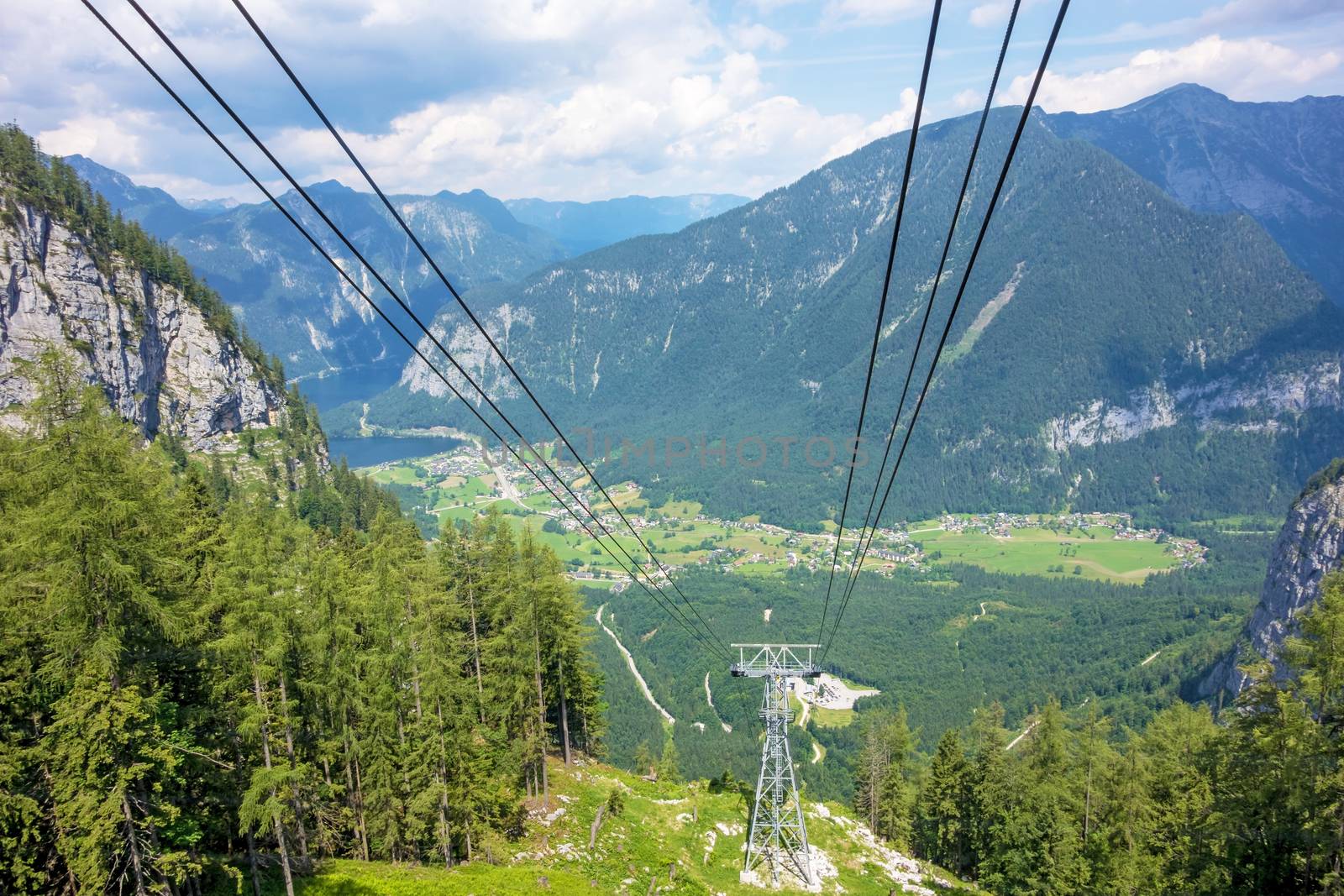 Obertraun, Austria - June 27, 2014: View of the village from the Dachstein ropeway gondola, a famous tourist destination of Salzburger Land for hikers.