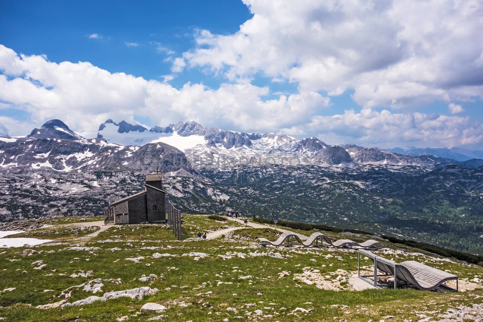 Mountain panorama at Dachstein-Krippenstein, wooden lounger, view of chapel