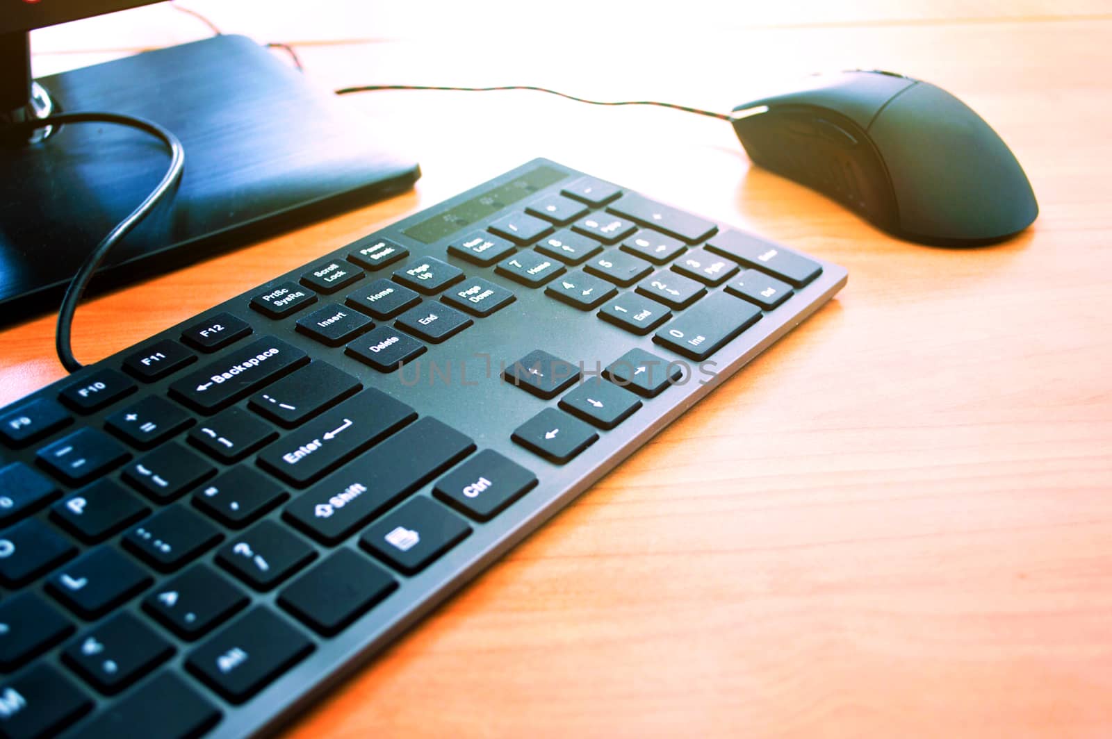 Computer mouse and keyboard on the office table. Computer technology conceptual image.