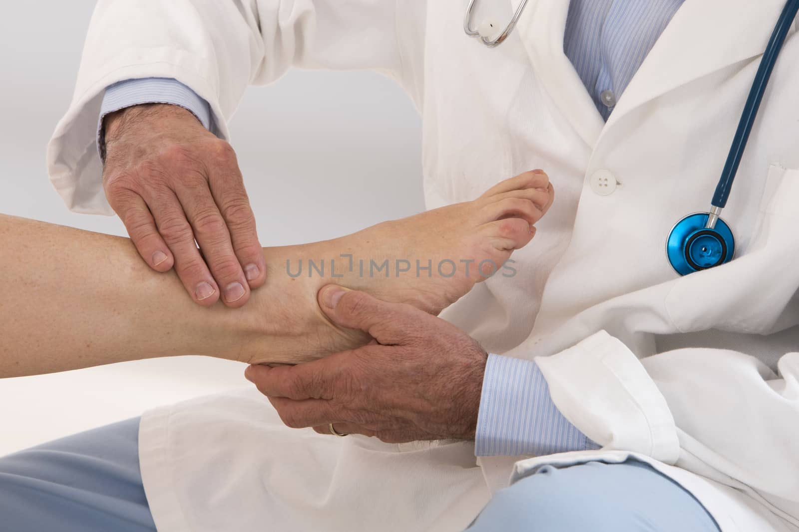 Ankle and Foot examination doctor to woman patient in hospital