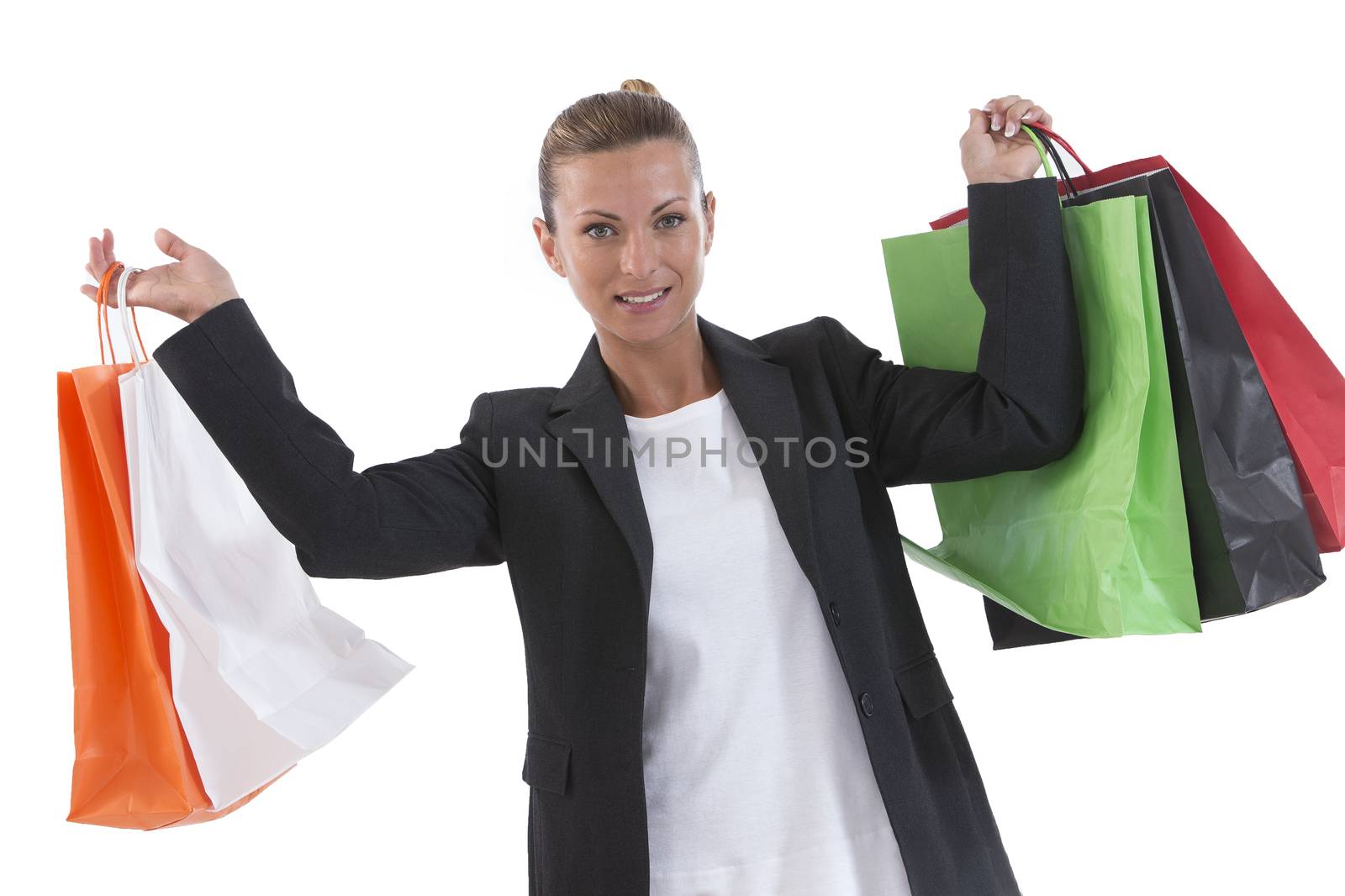 Young beautiful shopping woman during sale holding many colorful by JPC-PROD