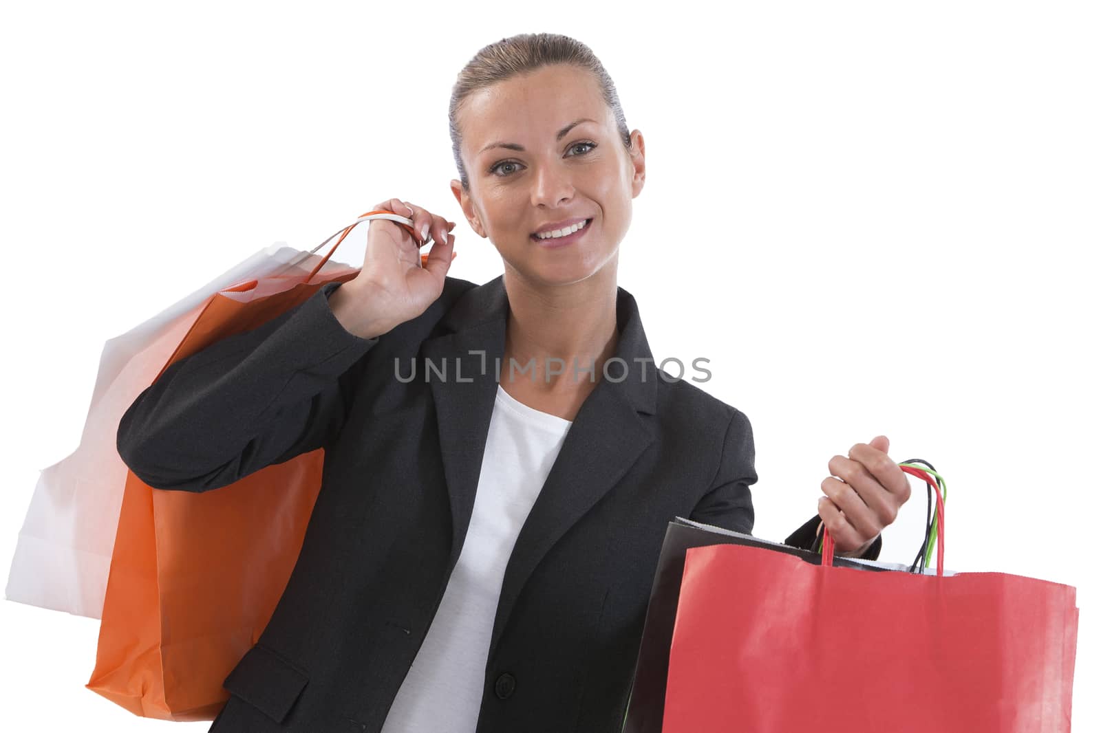 Young beautiful shopping woman during sale holding many colorful by JPC-PROD