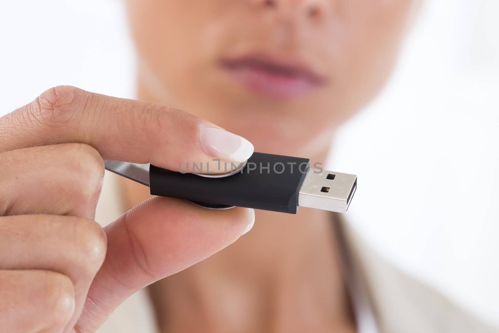 Flash drive ior USB key n a hand of the woman by JPC-PROD
