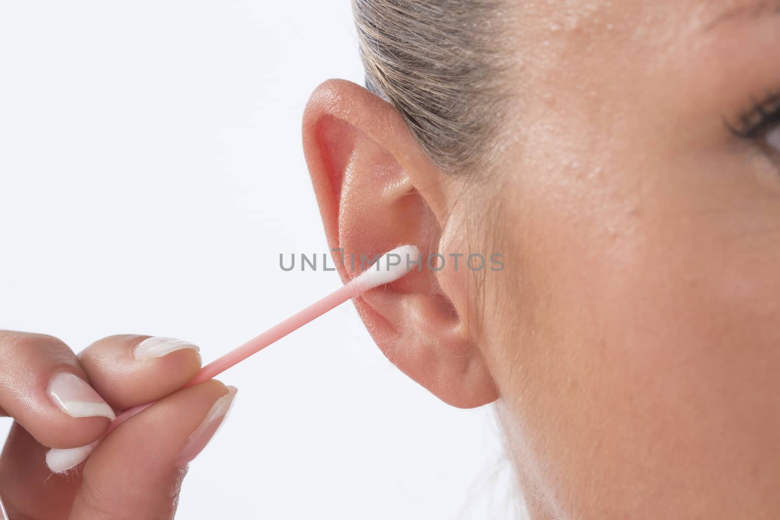 Female person using cotton stick