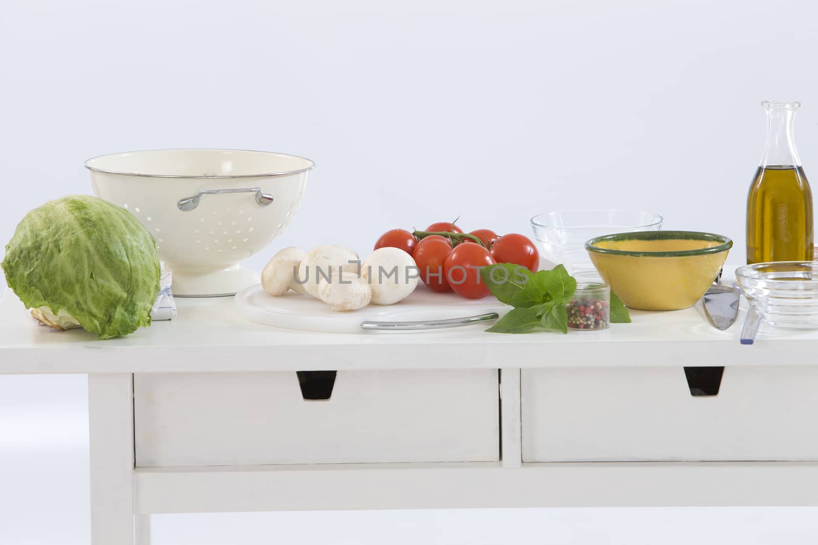 healthy foods are on the table in the kitchen on white background