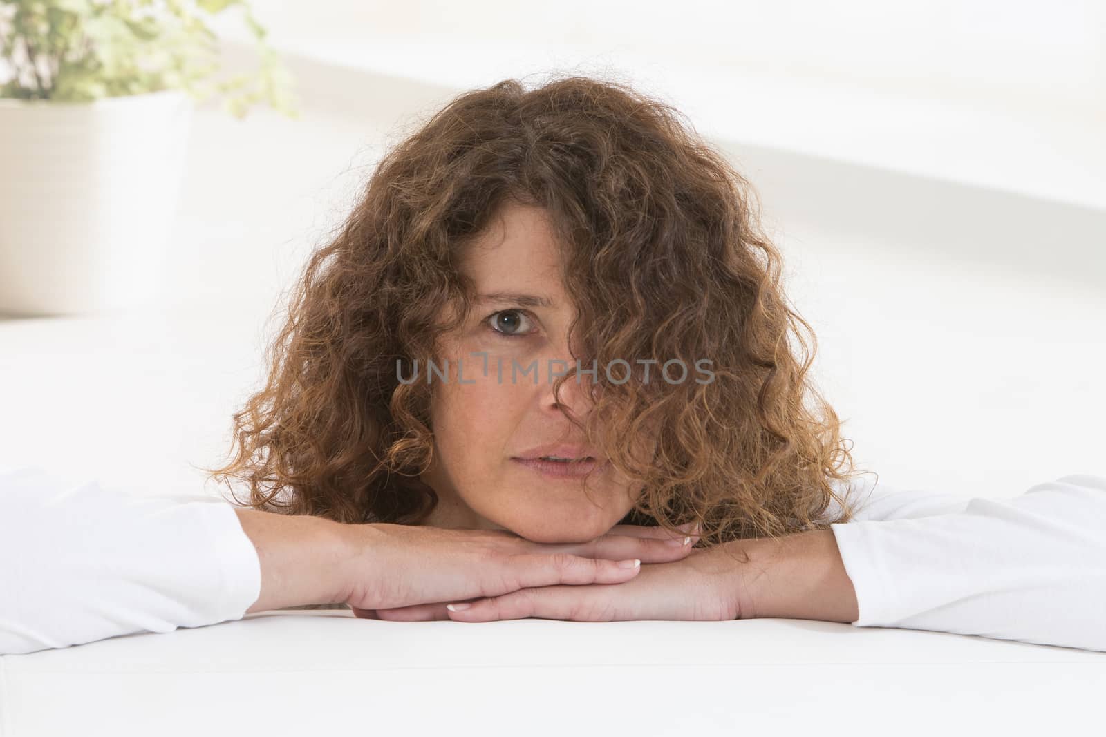 Mature woman thinking - closeup portrait