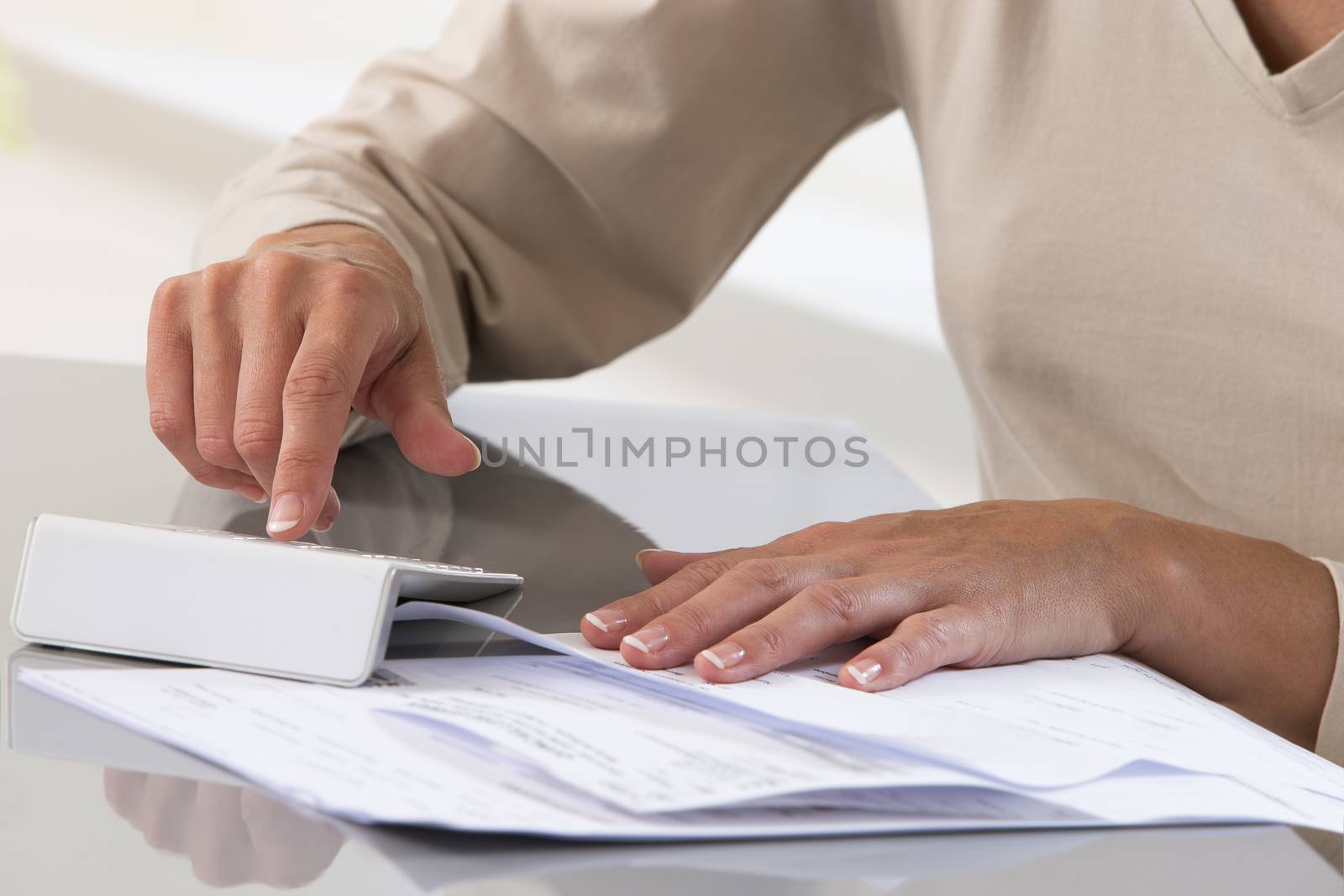 Business woman working with documents. (accountant, calculator, bookkeeping)