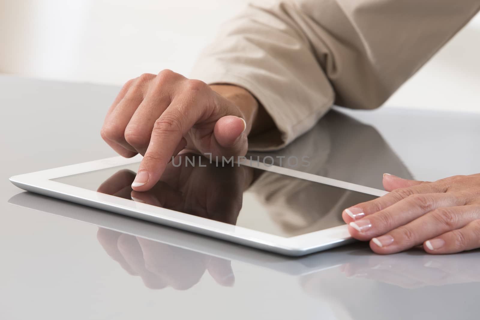 Hand of a businesswoman using a digital tablet