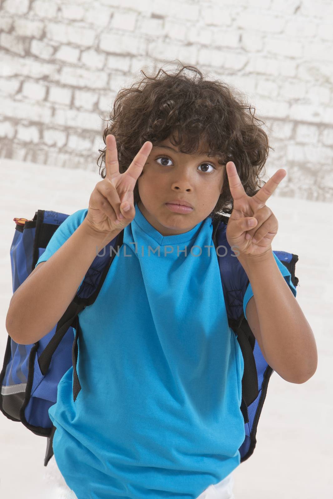 Adorable young kid ready for school with his bag by JPC-PROD
