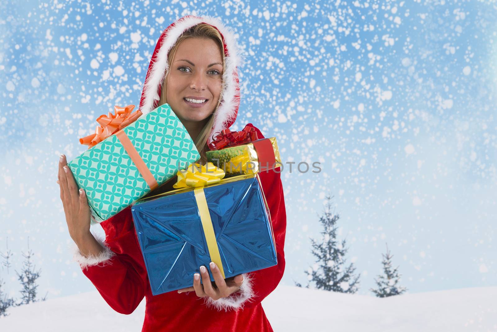 Beautiful young woman in Santa Claus clothes  with gifts on blue by JPC-PROD