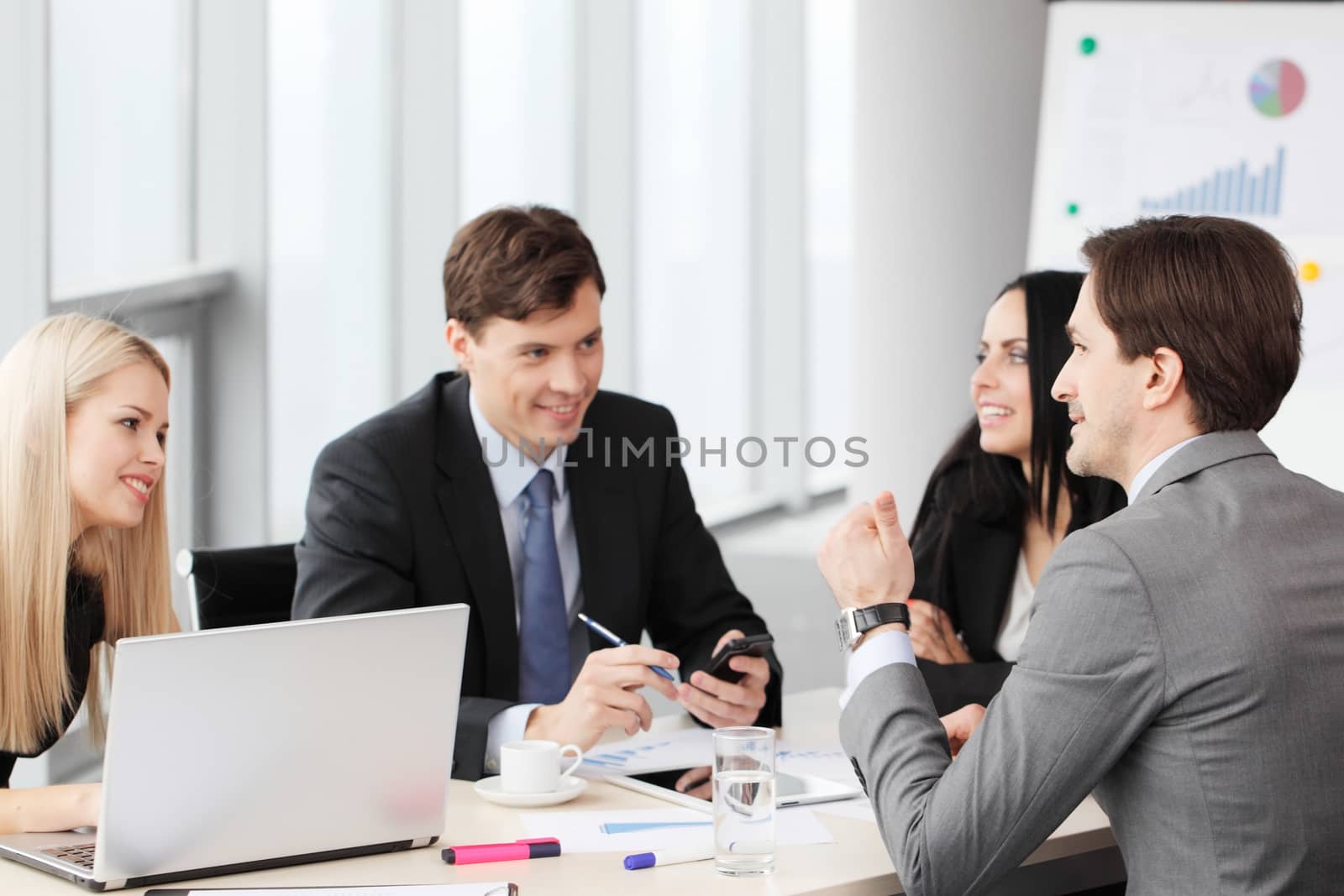 Business people analyzing financial reports in office