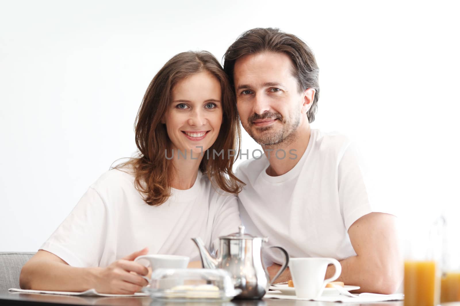 couple eating breakfast at kitchen