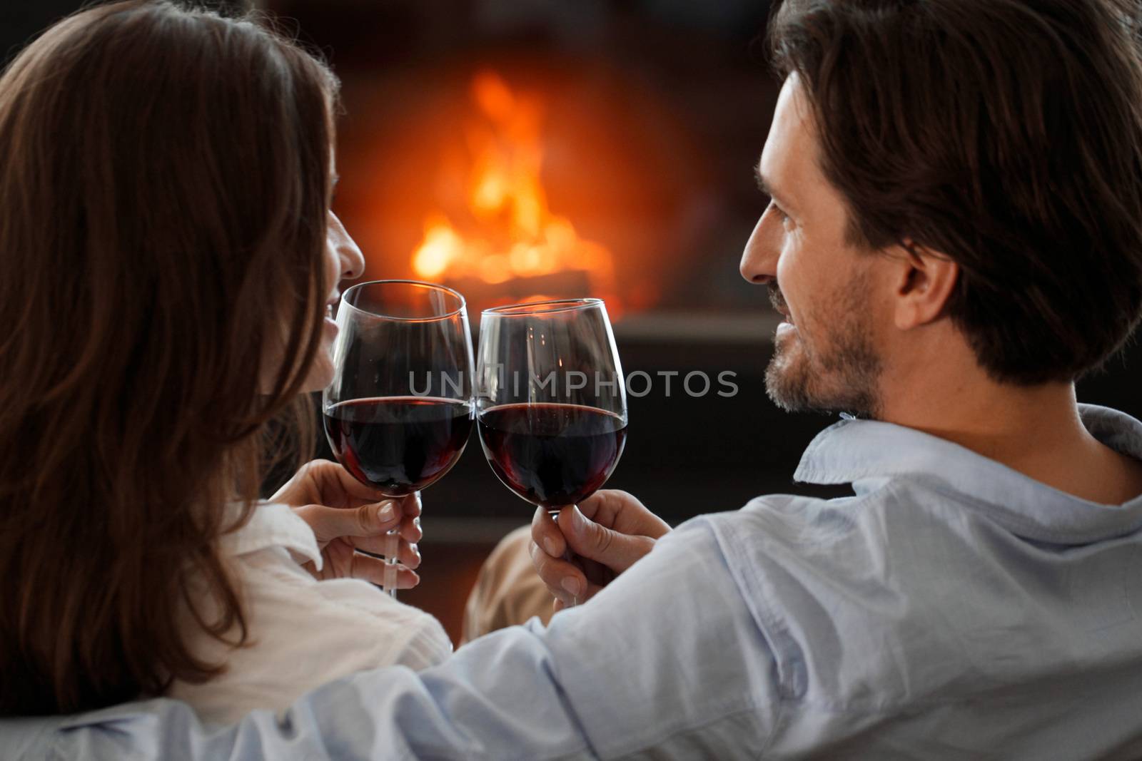 young couple next to the fireplace