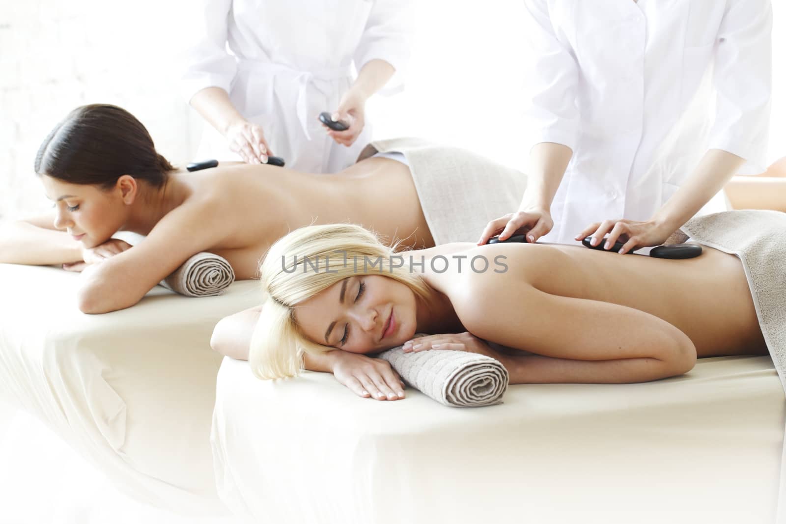 Two women getting massage by ALotOfPeople