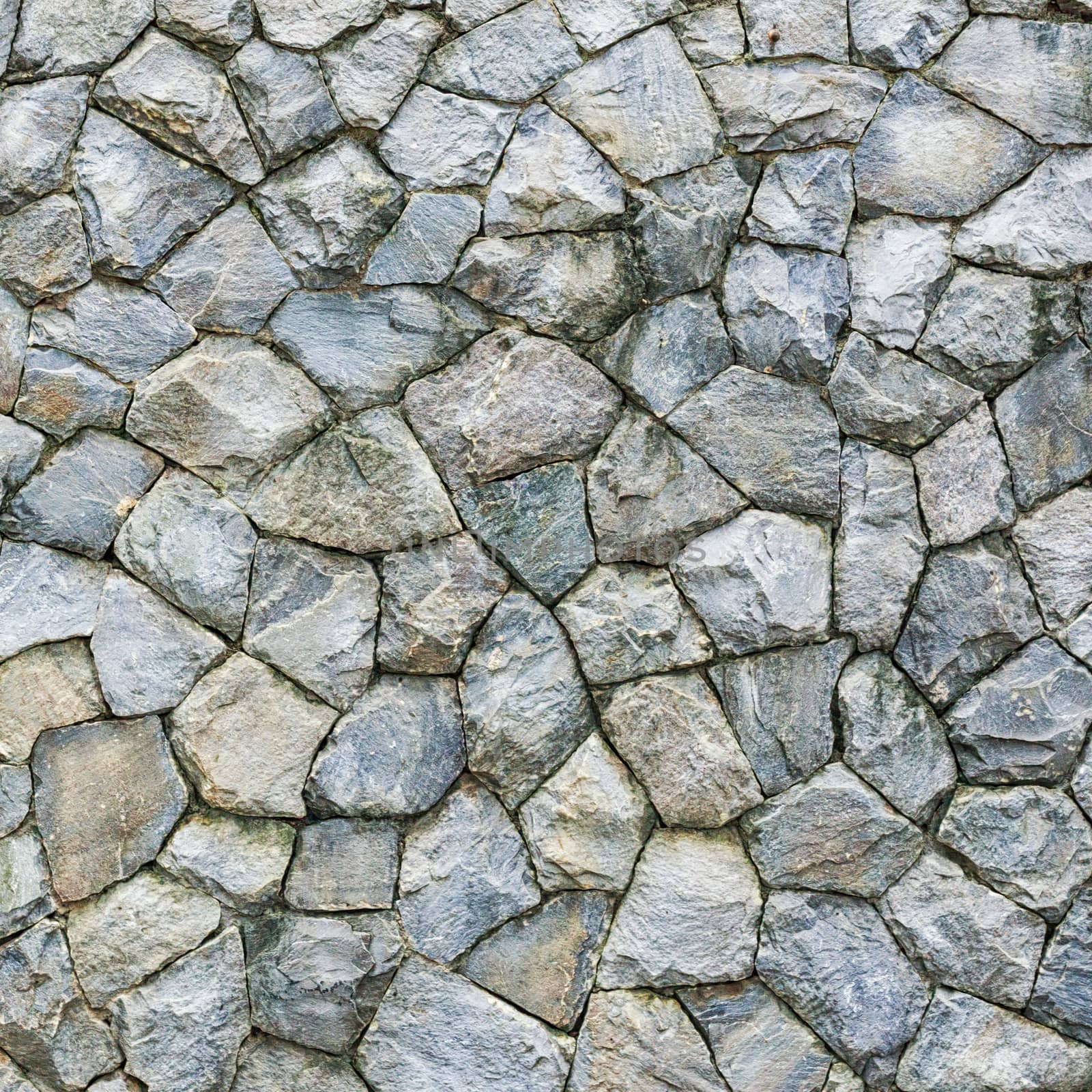 Stone wall Texture of different forms stones similar to wall by nopparats