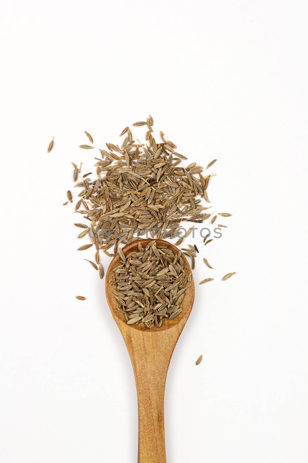 Cumin seeds close up isolated on white