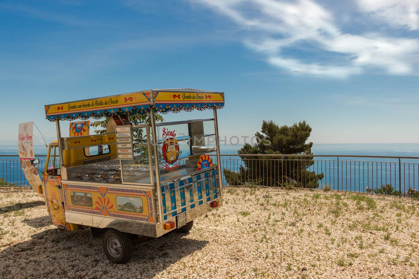 ACIREALE, ITALY - May 31, 2015: The traditional Italian apecar on the road. Ice cream served by small trucks around the streets.