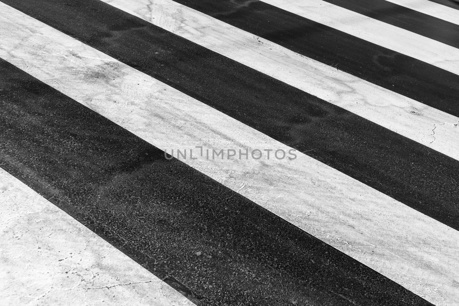 White painted pedestrian crossing on the road.