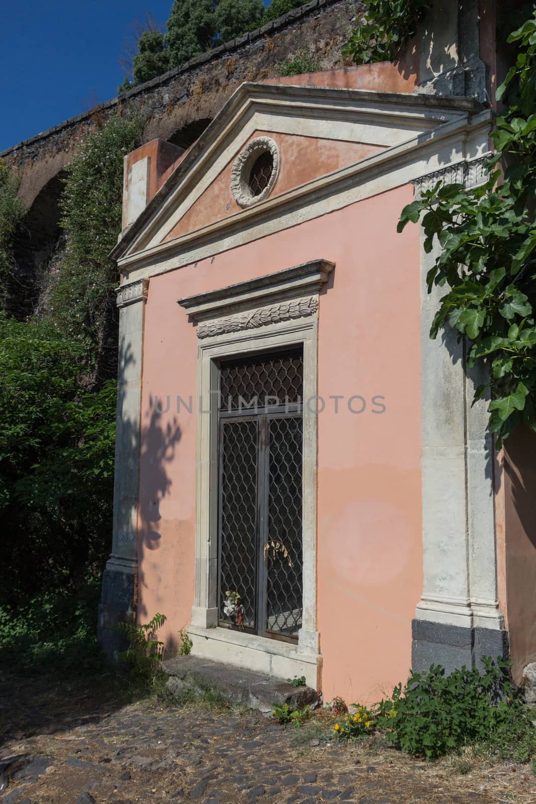 Small isolated church on old road.