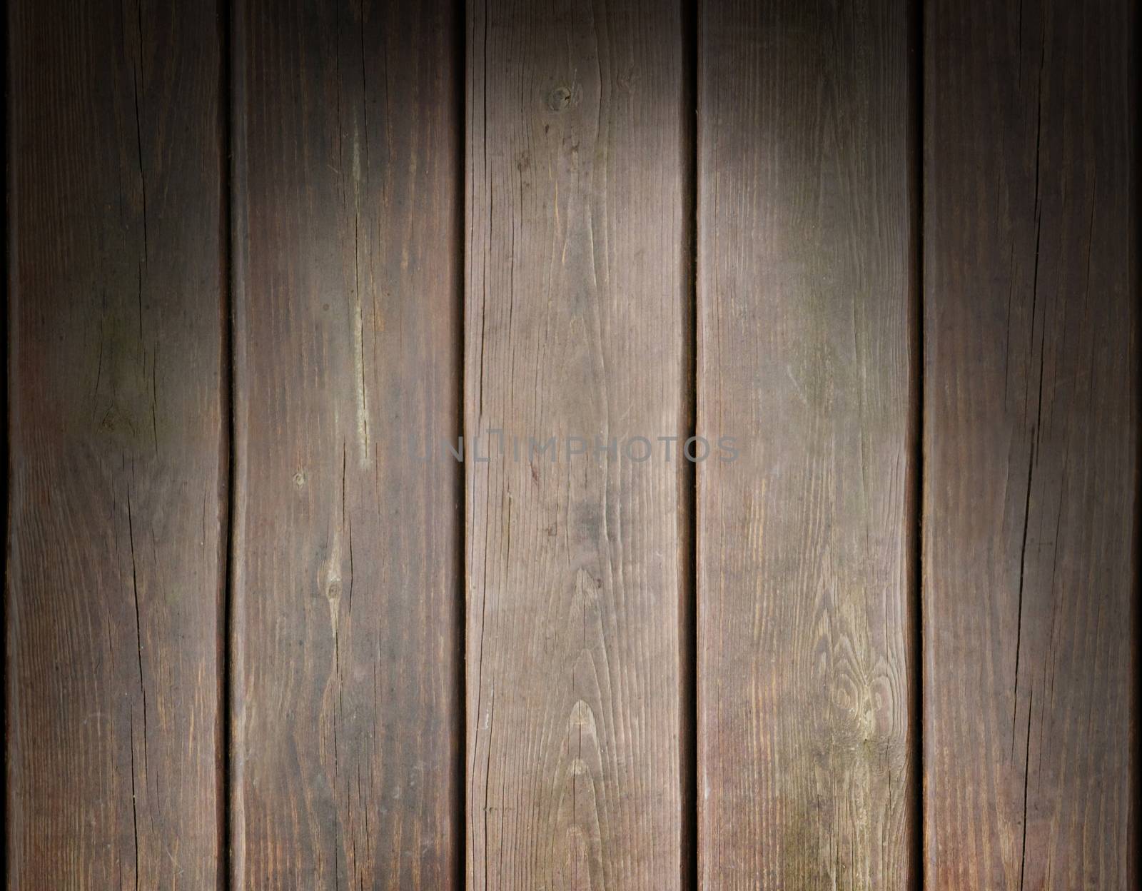 Weathered wooden plank background texture lit dramatically from above